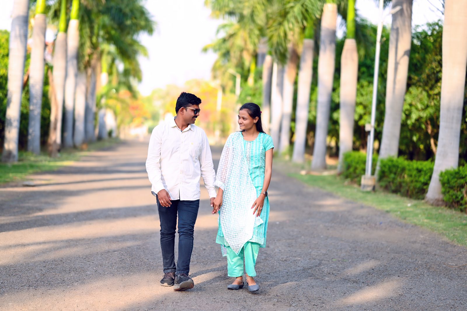 Pre-wedding walk down a palm avenue